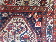 AN ANTIQUE PERSIAN TRIBAL RUNNER. 340 X 115CM