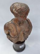 AN EARLY CARVED BUST OF A CLASSICAL MAIDEN WITH MARBLE BASE. H.OVERALL 34cms.