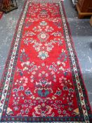 A PERSIAN LILIHAN RUNNER. 293 X 103CM