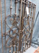 A GOOD QUALITY PAIR OF GOTHIC REVIVAL REVIVAL IRON WINDOW GRILLS.