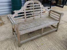 A GOOD QUALITY TEAK LUTYENS STYLE RAISED BACK GARDEN BENCH