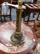 A VICTORIAN BRASS GOTHIC REVIVAL LAMP BASE, LATER ELECTRIFIED. OVER ALL HEIGHT 42CM