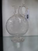 AN UNUSUAL VICTORIAN CARAFE WITH TWIST LOOP HANDLE AND ETCHED DECORATION OF A YOUNG MAN RIDING A