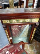 A LATE 19TH CENTURY MIRROR BACK CARVED MAHOGANY SHOP DISPLAY CABINET. DECORATED WITH FLORAL AND GILT