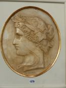 THREE OVAL PLASTER PROFILE PORTRAITS OF CLASSICAL MUSES AFTER THE ANTIQUE.