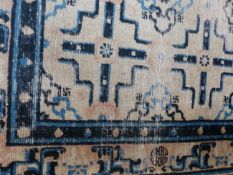 AN ANTIQUE CHINESE RUG. 220 X 128CM