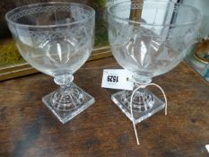 A NEAR PAIR OF ANTIQUE MASONIC DECORATED WINE GLASSES WITH LEMON SQUEEZER BASES