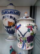 A CONTINENTAL URN FORM COVERED BLUE AND WHITE POTTERY DRUG JAR, POSSIBLY ITALIAN. H.29cms TOGETHER