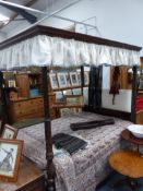 AN EDWARDIAN MAHOGANY FRAMED FOUR POSTER BED WITH PLEATED CANOPY.