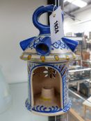 A DUTCH GOUDA TYPE POTTERY CANDLE LANTERN WITH BLUE AND WHITE DECORATION RETAILED BY LIBERTY & CO.