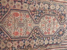 AN ANTIQUE PERSIAN TRIBAL RUG