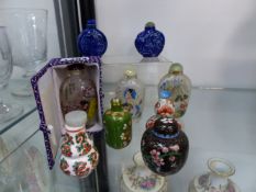 NINE VARIOUS DECORATED ORIENTAL POTTERY CLOISONNE AND GLASS SNUFF BOTTLES