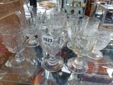 ELEVEN CUT GLASS LARGE WINE GOBLETS OF VARYING DESIGN