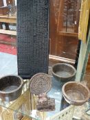 A GROUP OF INDIAN STONE BOWLS, ORNAMENTS AND A CARVED WOODEN PANEL POSSIBLY USED FOR PRINTING.