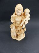 A WELL CARVED JAPANESE IVORY GROUP OF A MOTHER WITH TWO CHILDREN AND A BASKET OF FLOWERS. INCISED