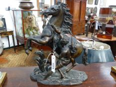 AFTER COUSTOU, A 19TH CENTURY BRONZE MARLEY HORSE GROUP. 38CM HGH