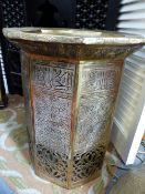 A PIERCED BRASS MOORISH DESIGN OCTAGONAL TABLE, OVERALL CALLIGRAPHIC AND GEOMETRIC DECORATION. H.