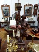 A CARVED WALNUT BAROQUE STYLE STANDING FIGURE HOLDING A TORCHERE, MOUNTED AS A LAMP. H.OVERALL