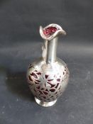 A HALLMARKED SILVER OVERLAID SMALL RUBY GLASS CARAFE. 15CM HIGH