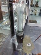 AN UNUSUAL MURANO HEAVY MOULDED GLASS SEATED FIGURE AND A STANDING CLEAR GLASS FIGURE ON CYLINDER