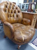 TWO BROAD SEATED LEATHER BUTTON BACK LIBRARY ARMCHAIRS.