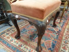 AN ANTIQUE GEO.I.STYLE WALNUT STOOL ON CARVED CABROLE LEGS.