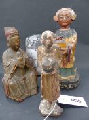 THREE ORIENTAL CARVED GILT AND POLYCHROME FIGURES AND AN UNUSUAL EASTERN PLAQUE WITH HORSE AND