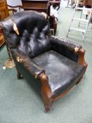 A PAIR OF VICTORIAN CARVED WALNUT GENTLEMAN'S LIBRARY ARMCHAIRS WITH NAILED AND BLACK BUTTONED