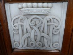 TWO CARVED WHITE MARBLE PANELS OF FAMILY CYPHERS, A CROWN ABOVE INTERLACED MONOGRAM LETTERS IN