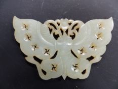 A CHINESE CARVED HARDSTONE PENDANT IN THE FORM OF A BUTTERFLY, CONFORMING HARDWOOD BASE