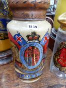 A 19TH CENTURY GILT DECORATED APOTHECARY JAR WITH TOLE WARE COVER, ORDER OF THE GARTER CREST AND
