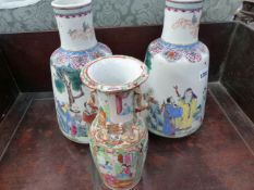A PAIR OF ORIENTAL FAMILLE ROSE TAPERED FORM BOTTLE VASES WITH FIGURAL DECORATION. 32CM HIGH AND A
