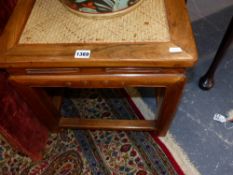 A PAIR OF CHINESE CARVED TABLES WITH INSET WICKER TOPS AND STRETCHED LEGS.