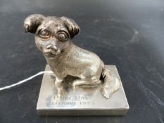 A CHINESE EXPORT SILVER COLOURED METAL MODEL OF A PEKINESE DOG ON A PLINTH ENTITLED POOR PAT,