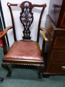 A GEO.III.STYLE MAHOGANY ARMCHAIR WITH ELABORATE PIERCED BACK ON CLAW AND BALL FEET TOGETHER WITH