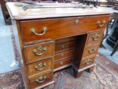 A GEORGIAN MAHOGANY AND BOXWOOD STRUNG SMALL KNEEHOLE WRITING DESK WITH UNUSUAL CENTRE DRAWER.