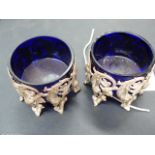 A PAIR OF CONTINENTAL SALTS WITH PIERCED BIRD AND FLORAL DECORATION