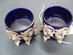 A PAIR OF CONTINENTAL SALTS WITH PIERCED BIRD AND FLORAL DECORATION