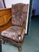 A LARGE CARVED 17TH.C.STYLE OPEN ARMCHAIR WITH TAPESTRY STYLE UPHOLSTERY.