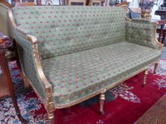 A GEO.IV.ENGLISH GILTWOOD SHOW FRAME SETTEE WITH BUTTON UPHOLSTERY STANDIND ON BRASS CUP CASTORS.