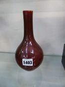 A CHINESE MONOCHROME LIVER GLAZE BOTTLE FORM VASE WITH SIX CHARACTER MARK TO BASE. 19CM HIGH