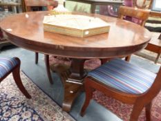 AN EARLY VICTORIAN MAHOGANY CIRCULAR BREAKFAST TABLE ON FLARED COLUMN SUPPORT AND PLATFORM BASE.