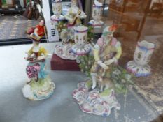 A PAIR OF 18TH.C.STYLE PORCELAIN FIGURAL AND BOCAGE TWIN LIGHT CANDELABRA AND ANOTHER SIMILAR FIGURE