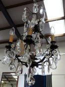 A FRENCH SIX LIGHT CAGE FORM PRISM HUNG CHANDELIER IN THE LOUIS XV STYLE. H.68cms.