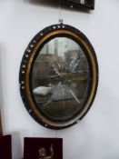 TWO IRISH OVAL MIRRORS WITH GLASS CABUCHON APPLIED BORDERS.