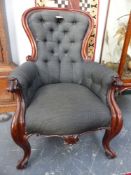 A VICTORIAN MAHOGANY SHOW FRAME BUTTON BACK ARMCHAIR AND A SIMILAR LATE VICTORIAN EXAMPLE ON