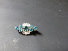 An Art Deco diamond and blue zircon bar brooch.