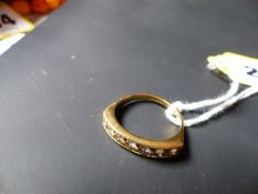 An 18ct gold seven stone diamond dress ring.