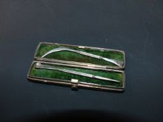 A 19th Century Continental silver coloured metal etui with ear wax and toothpick utensil and a