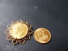 A Victorian gold sovereign dated 1868 in 18ct gold mount together with an Edward VII gold